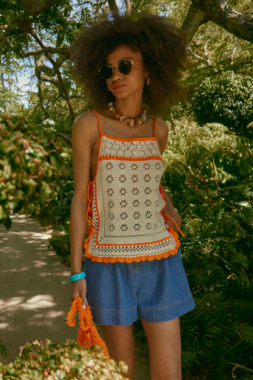These denim shorts have slant front pockets, back pockets, an elastic waist and special buttons.