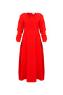 The Delancey Dress is long-sleeve with a shirred round neckline, banded cuffs, and a full skirt.