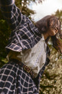 The Dorrington Jacket in St. Andrews Check paired with matching Queenby Skirt and Finch Top in white