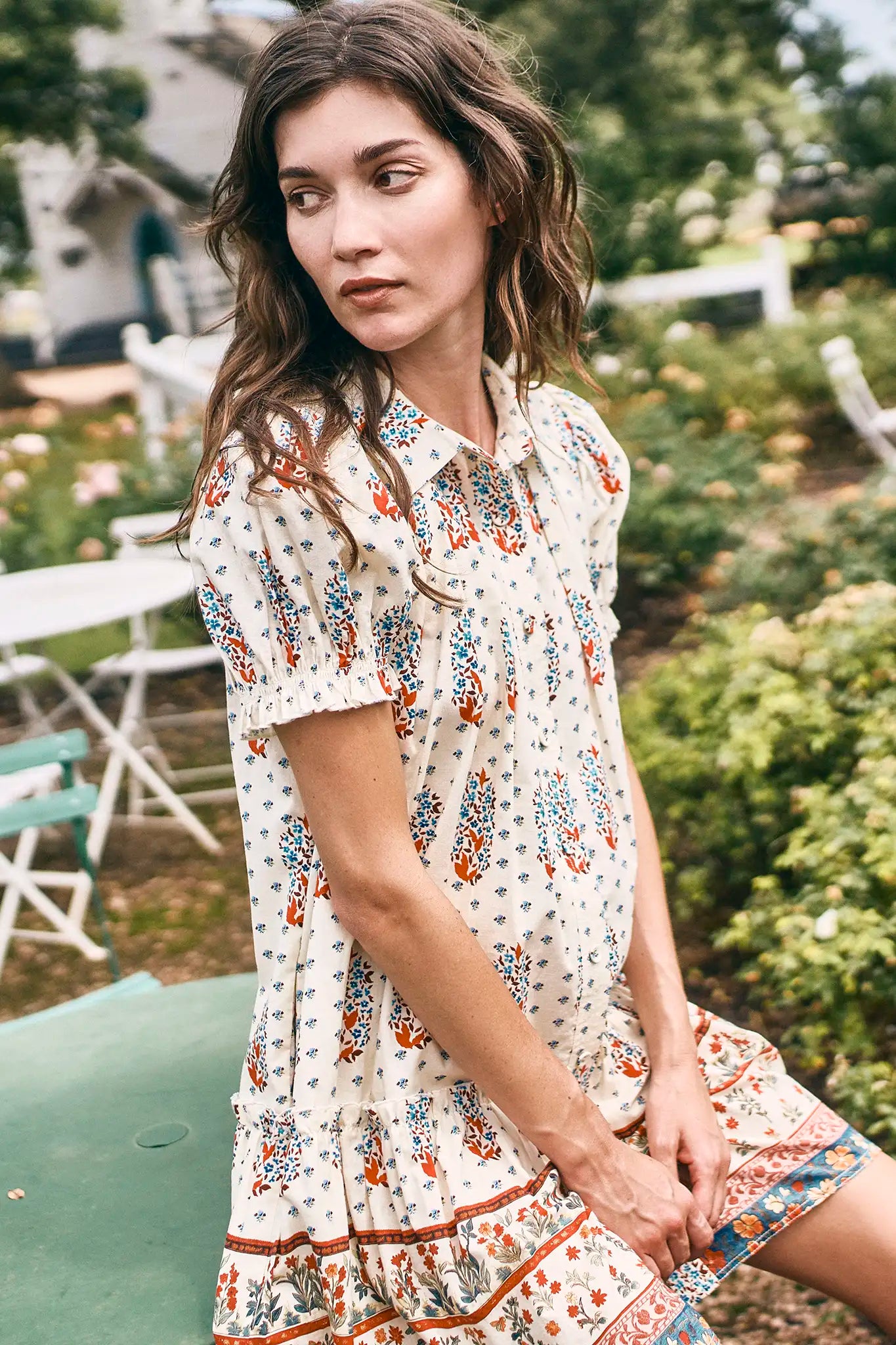 The Drifter Mini has a collared neckline, short puff sleeves, a drop waist and flounce hem.