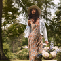 The Ella Lee Dress in Gertrude print paired with Solene Jacket in Washed Blue Denim. 