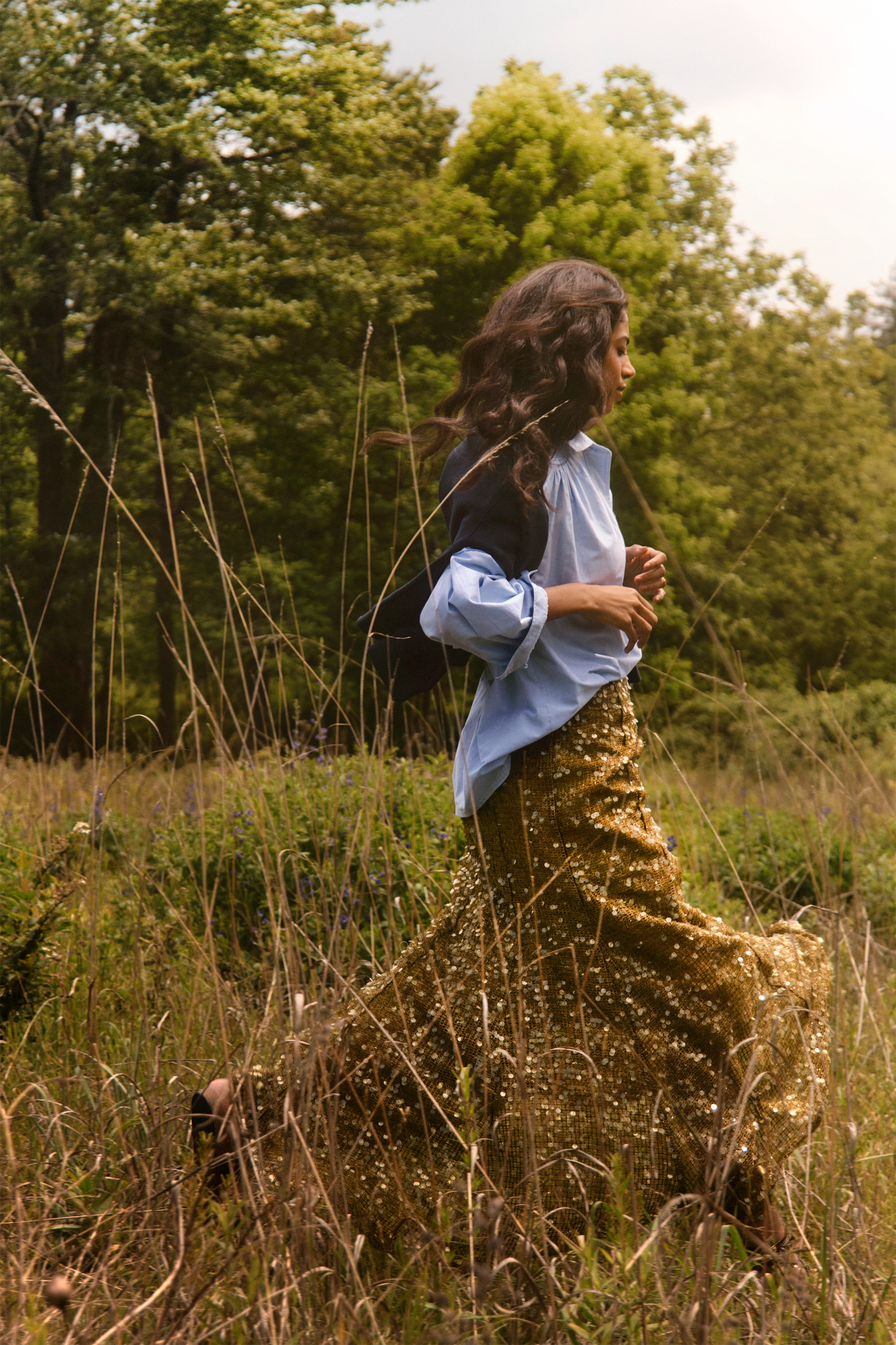 The Evangeline Shirt in Oxford Blue paired with the Lindsey Skirt in Moss Sequin. 