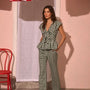 The Everly Top with matching Juno Pants in Hamilton Check paired with pale yellow shoes.