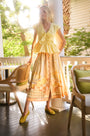 Eva Skirt in Still Life Symphony paired with Everly Top in Lemon Meringue, outside on porch.