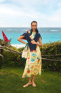 The Faith Dress in Wish You Were Here print paired with St. Georges Sweater.
