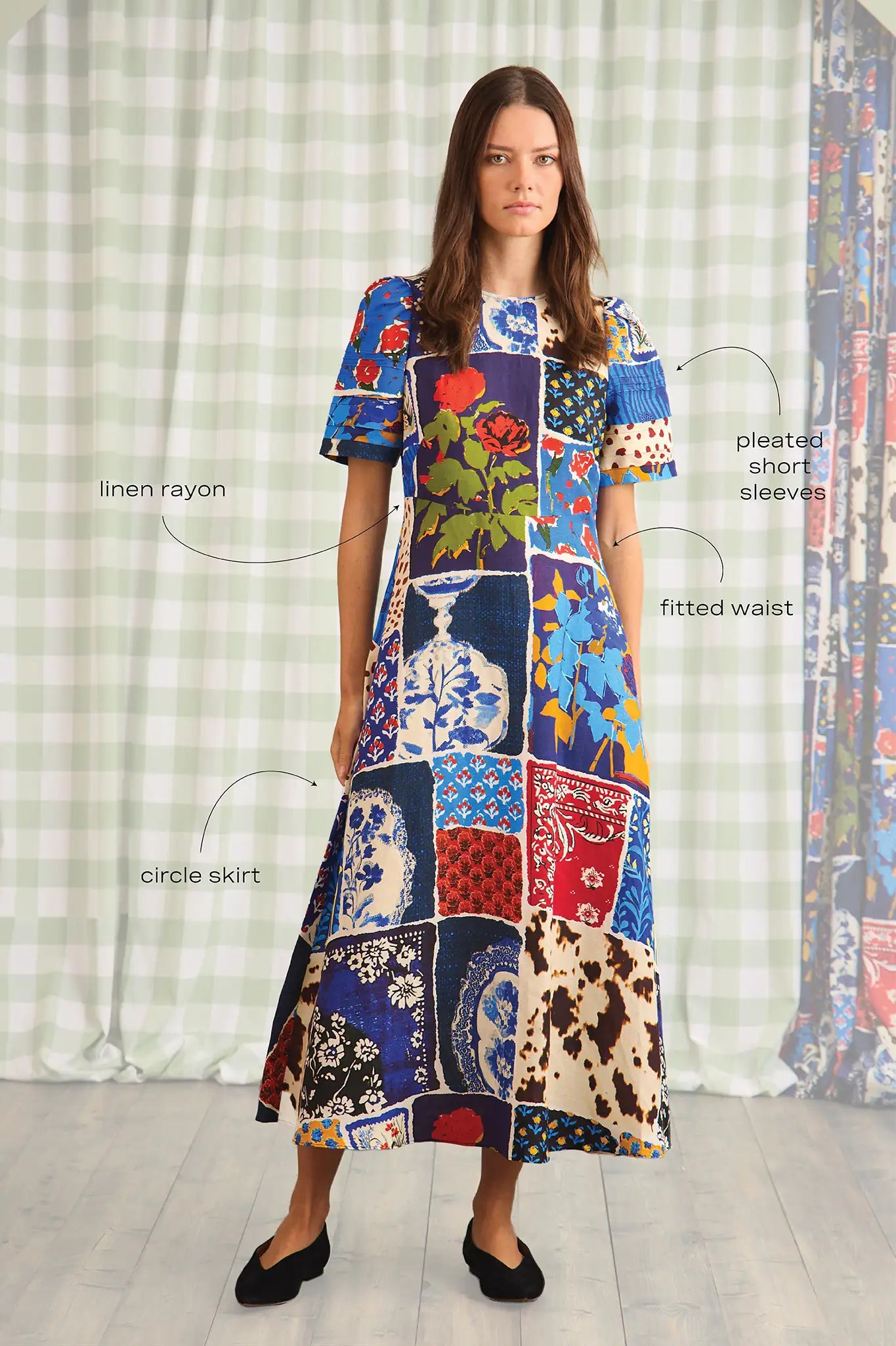 The Casey Dress is a sheath midi with a curved waist seam, relaxed skirt and pleated short sleeves.