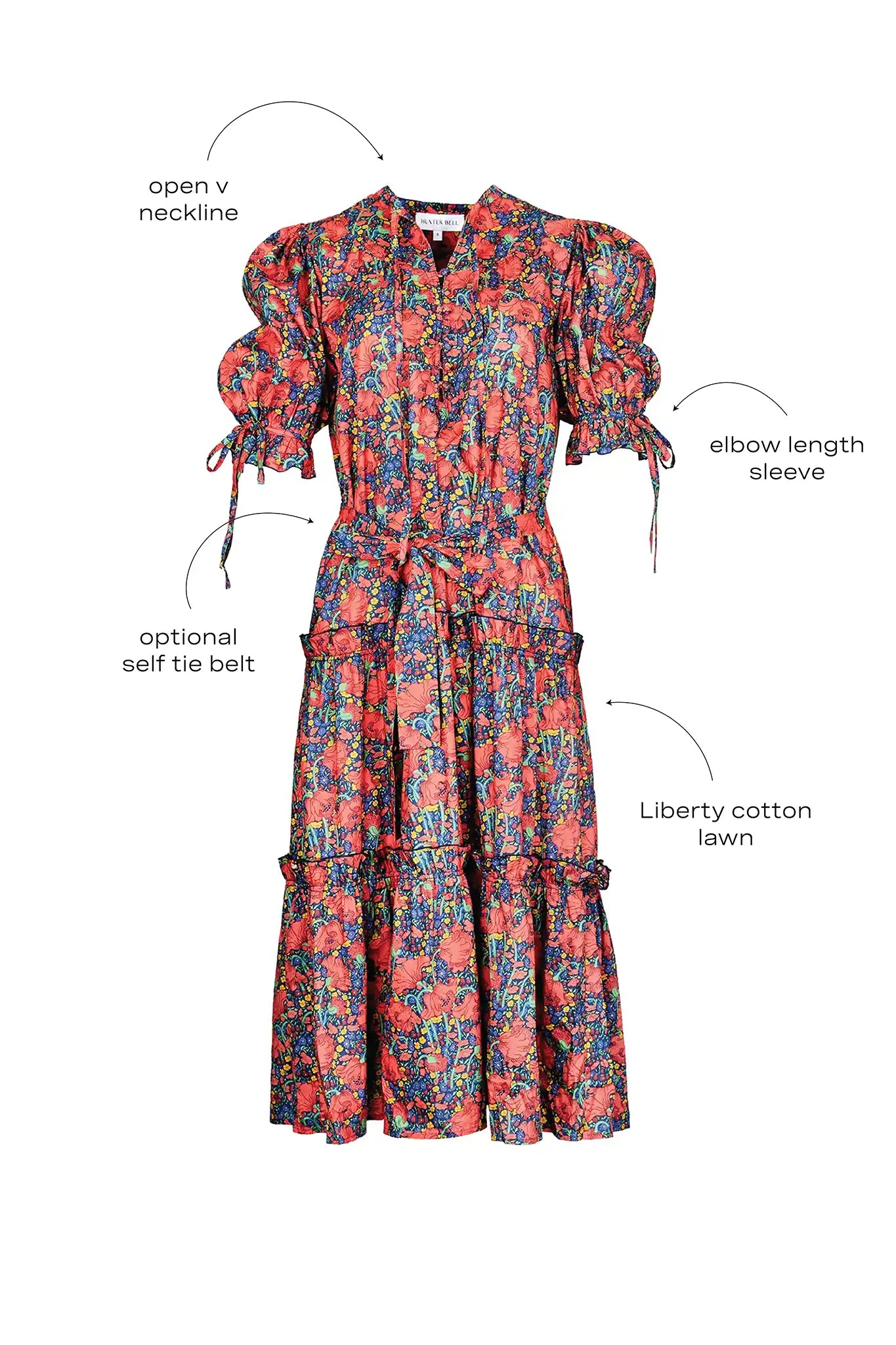 The Holloway Dress has v-neck, elbow-length puff sleeves, tiered ruffled seams and an optional sash.