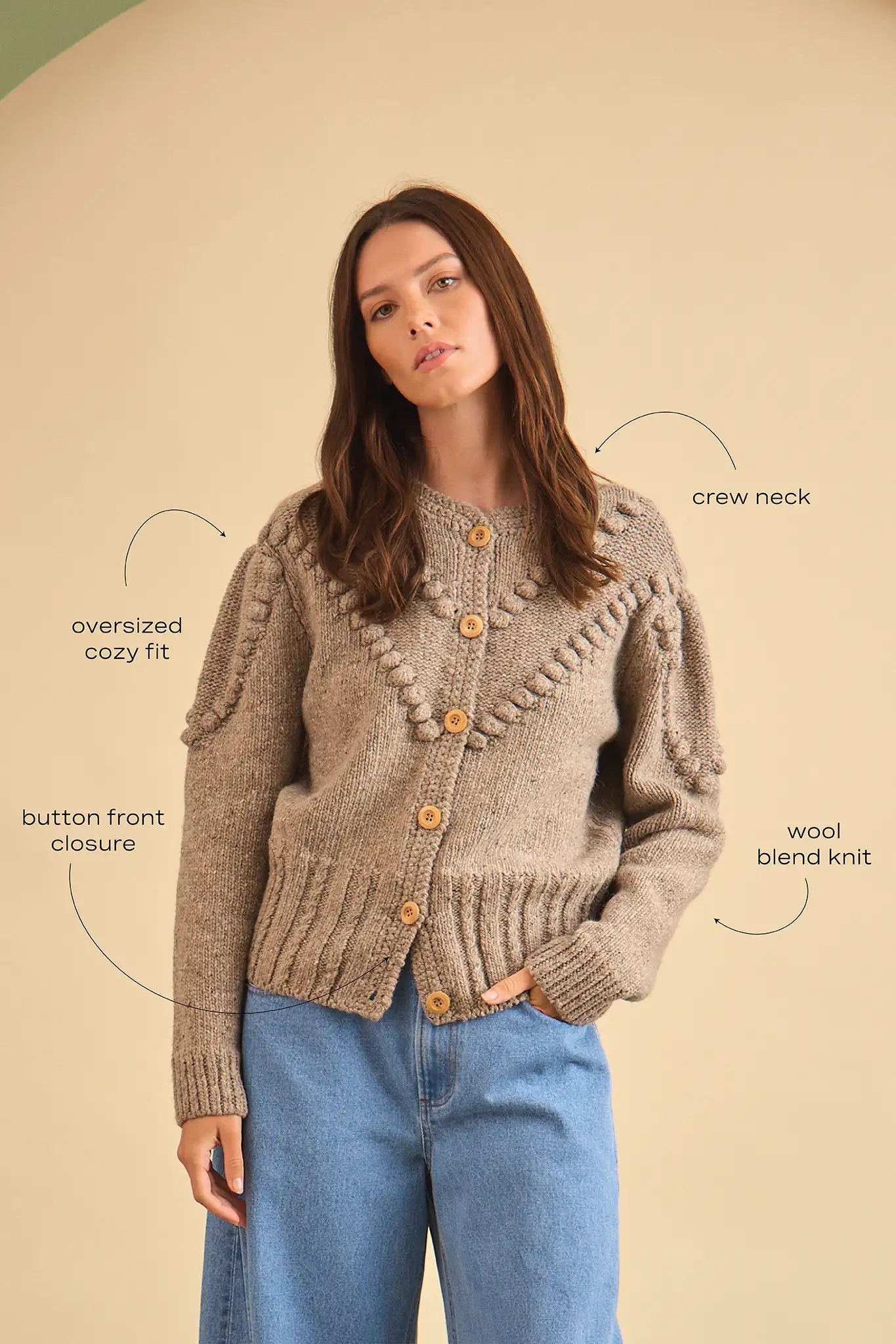 The Bobble Sweater is a crew neck style with a button-front, long sleeves and an oversized fit.