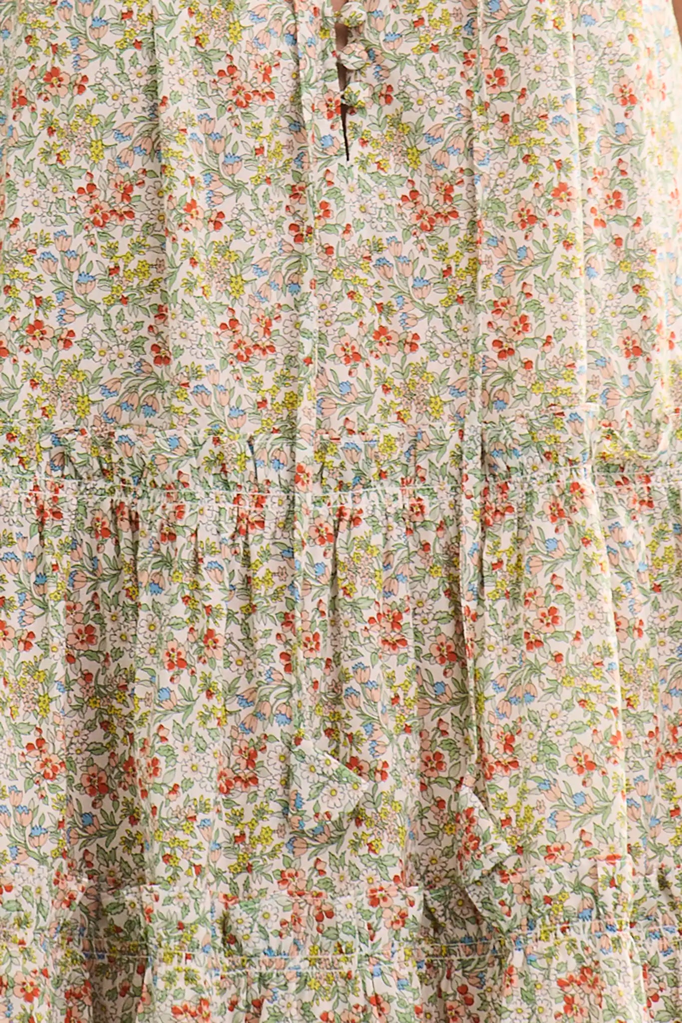 Close up of The Fawn Dress in Coral Multi.