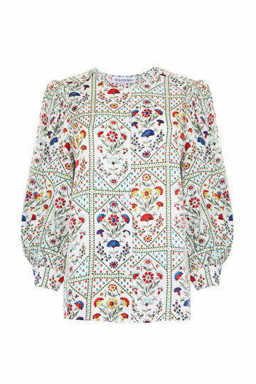 The Finley floral blouse has three quarter length sleeves and a center front placket.