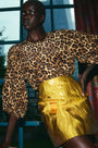 The Finley Blouse in Soho Leopard Camel paired with the Britt Mini Skirt in Gilded Jacquard.