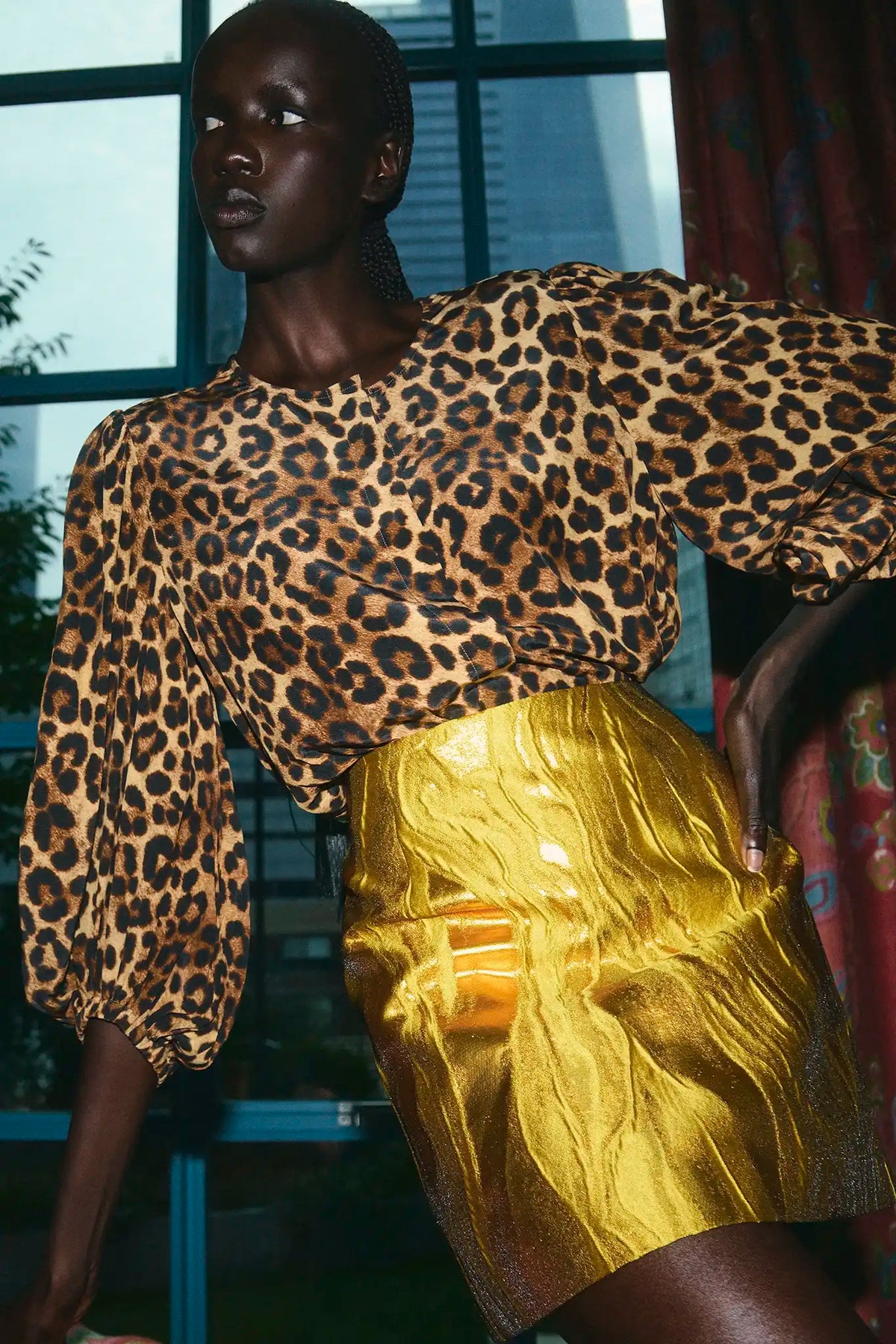 The Finley Blouse in Soho Leopard Camel paired with the Britt Mini Skirt in Gilded Jacquard.