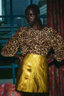 The Finley Blouse in Soho Leopard Camel paired with the Britt Mini Skirt in Gilded Jacquard.