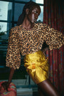 The Finley Blouse in Soho Leopard Camel paired with the Britt Mini Skirt in Gilded Jacquard.