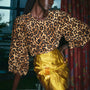 The Finley Blouse in Soho Leopard Camel paired with the Britt Mini Skirt in Gilded Jacquard.