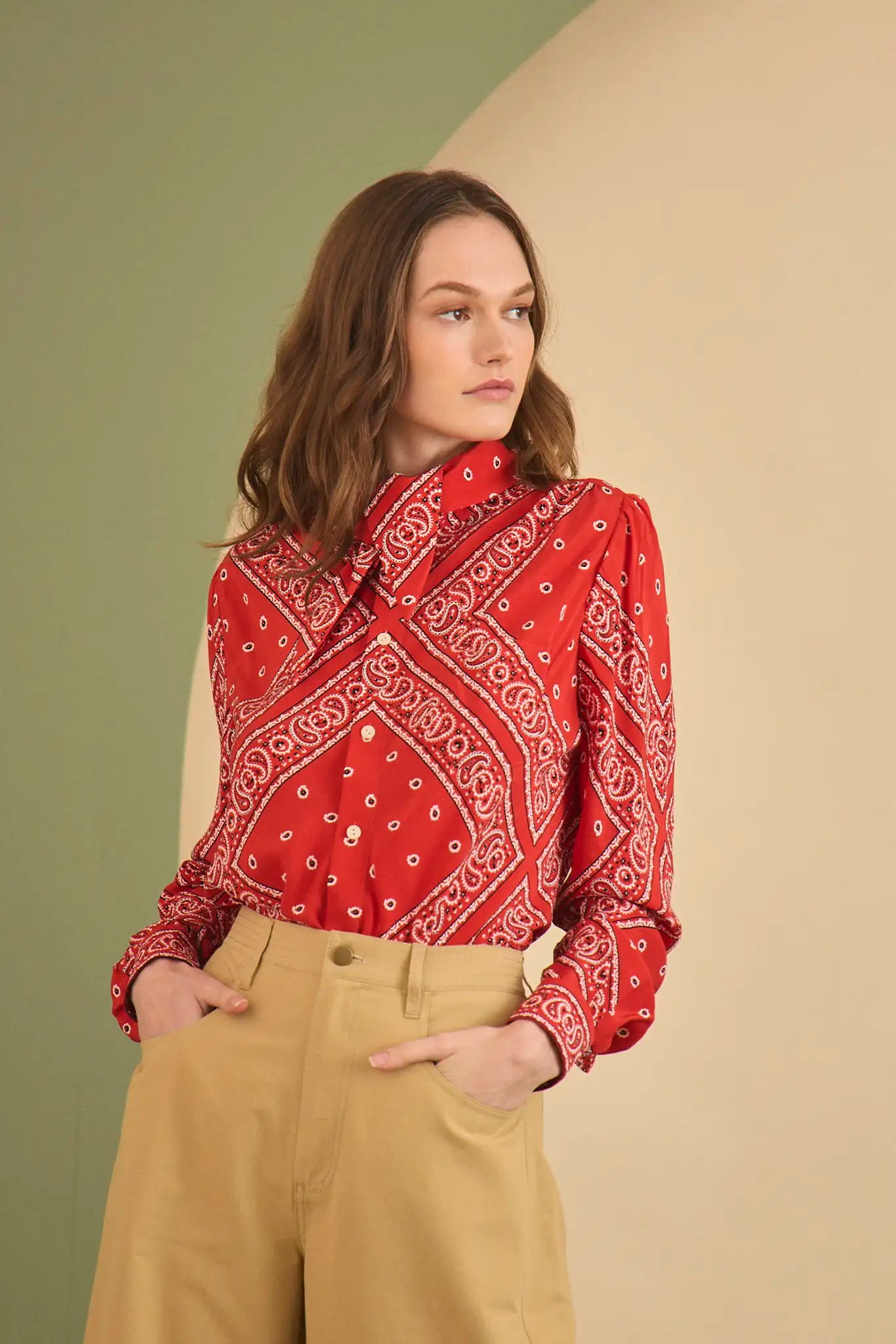 The Frances Top has a button front, long sleeves, button cuffs and a scarf collar detail.