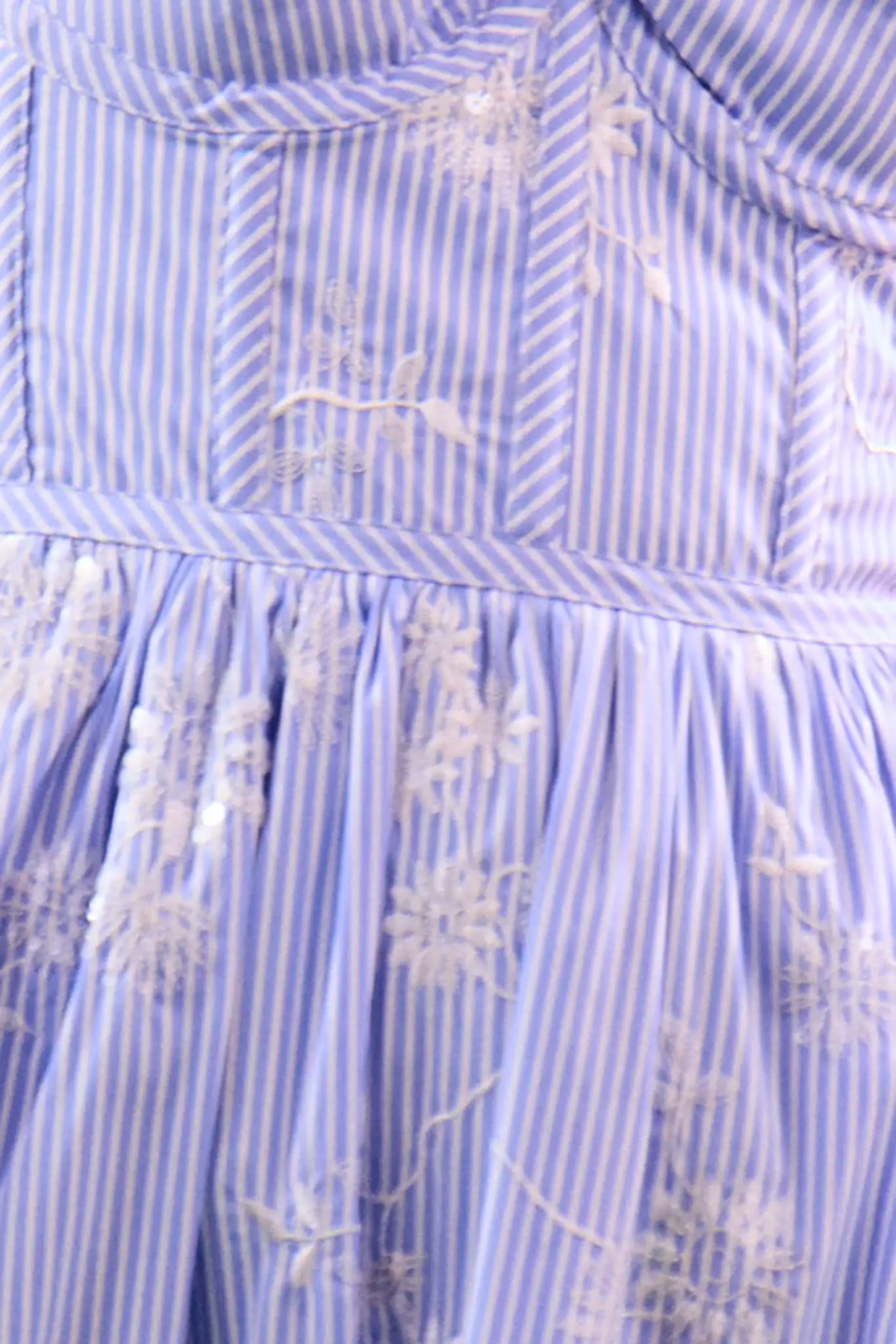 Close up of the Gracie Dress, midi dress with embroidery and full skirt, in Sullivan Stripe.