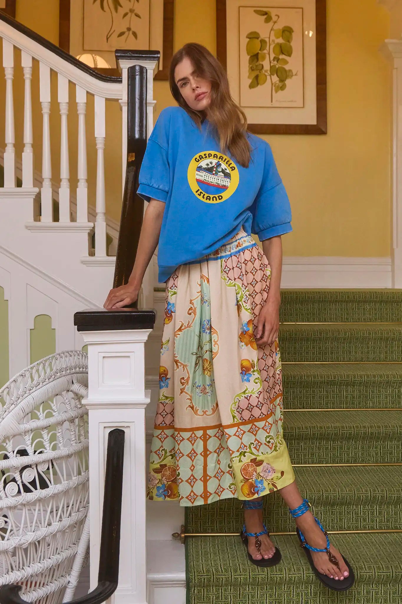 The Tatum midi skirt in gasparilla gardens has a covered elastic waist and a billowy silhouette.