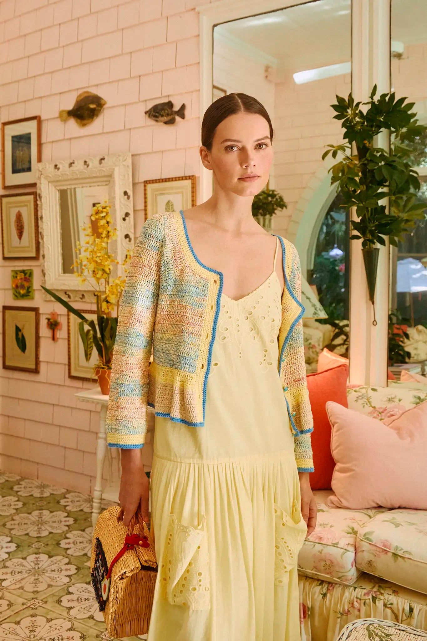 The Martin Dress has eyelet embroidery, a drop waist, shirred skirt, and spaghetti straps.