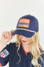 The Hunter Bell x Freya Trucker Hat in Navy paired with navy soccer jersey.