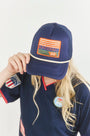 The Hunter Bell x Freya Trucker Hat in Navy paired with navy soccer jersey.