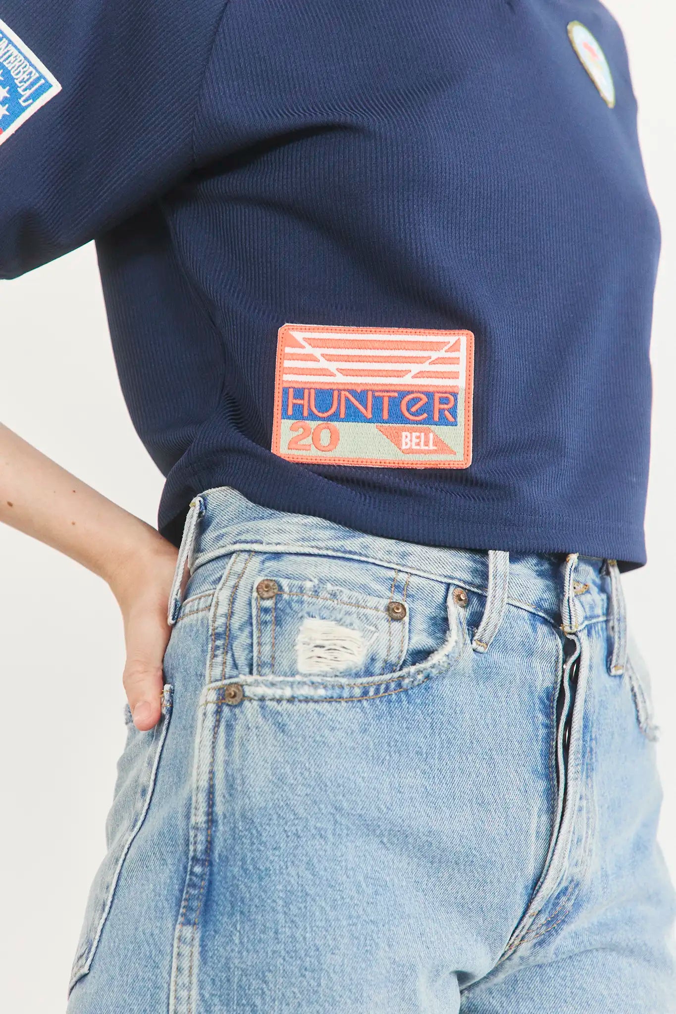 The Hunter Bell x Freya Trucker Hat in Navy paired with navy soccer jersey.