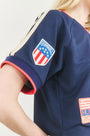 The Hunter Bell x Freya Trucker Hat in Navy paired with navy soccer jersey.