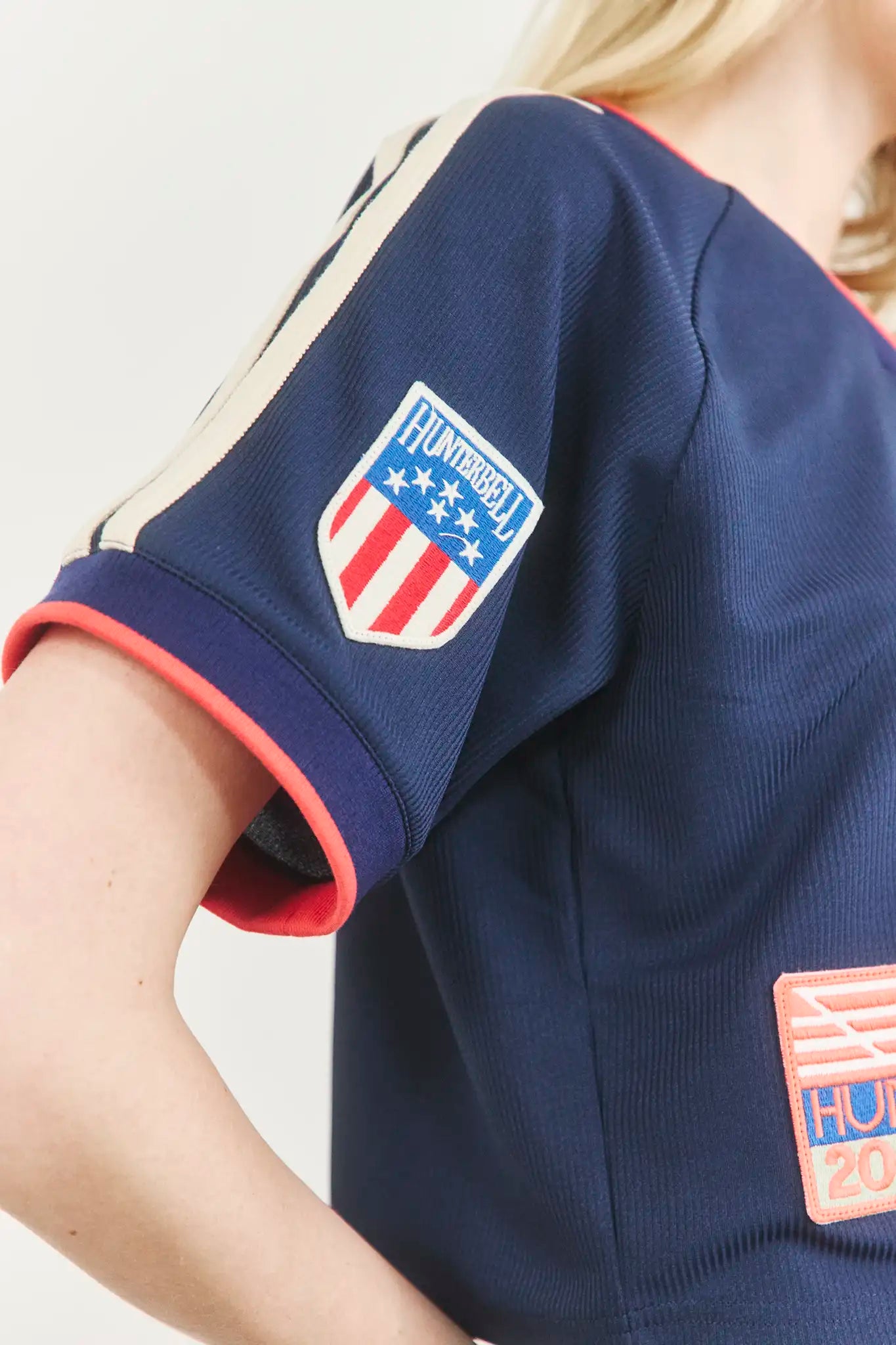 The Hunter Bell x Freya Trucker Hat in Navy paired with navy soccer jersey.