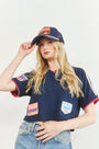 The Hunter Bell x Freya Trucker Hat in Navy paired with navy soccer jersey.
