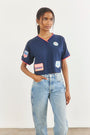 The Hunter Bell x Freya Trucker Hat in Navy paired with navy soccer jersey.