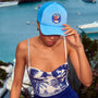 The Nevis One Piece in Bermuda Toile paired with Allegra Skirt in Deep Sea. 