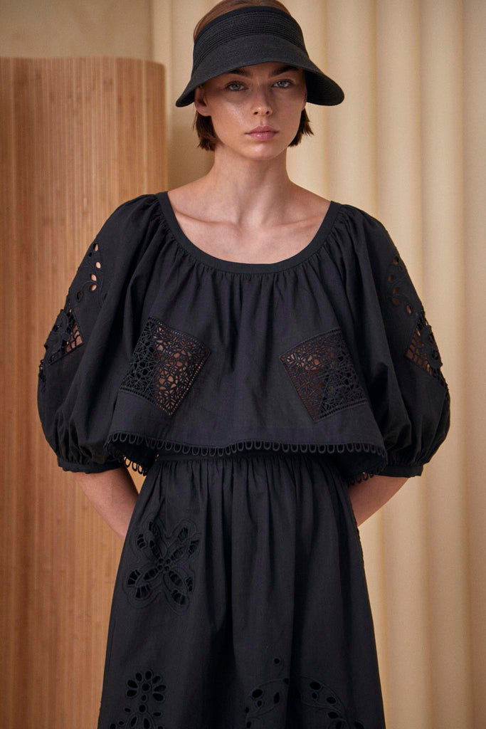 The Daisy blouse has a cropped profile, raglan sleeves, bobble trim and eyelet embroidery.