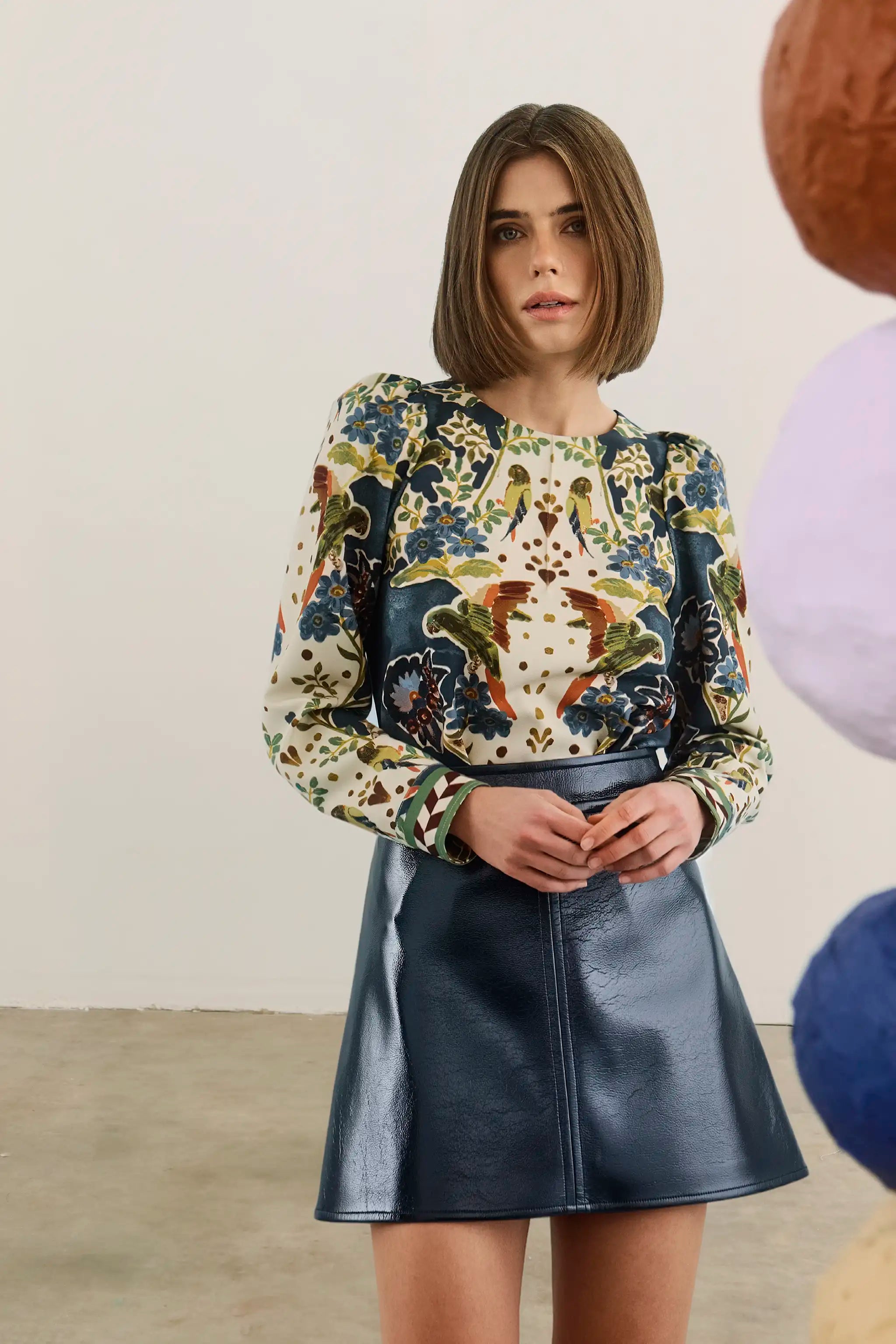 The Harris Top in Birds of a Feather Navy paired with the Meeghan Mini Skirt in Navy. 