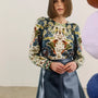 The Harris Top in Birds of a Feather Navy and the Meeghan Mini Skirt in navy.