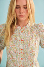 The Hartley Top in Coral Multi, puff sleeve blouse with coral buttons.