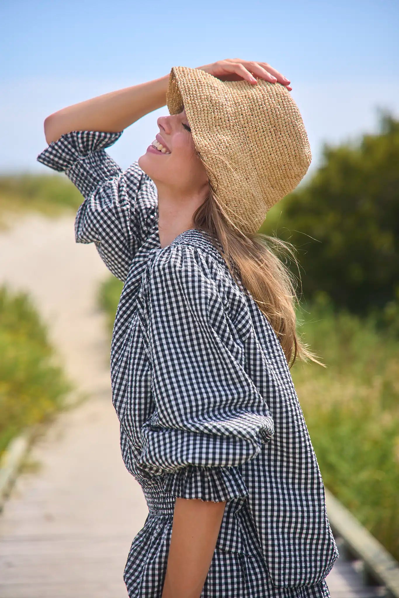 The Hayes Blouse in Black and White Gingham paired with matching Jemma Shorts paired with straw hat