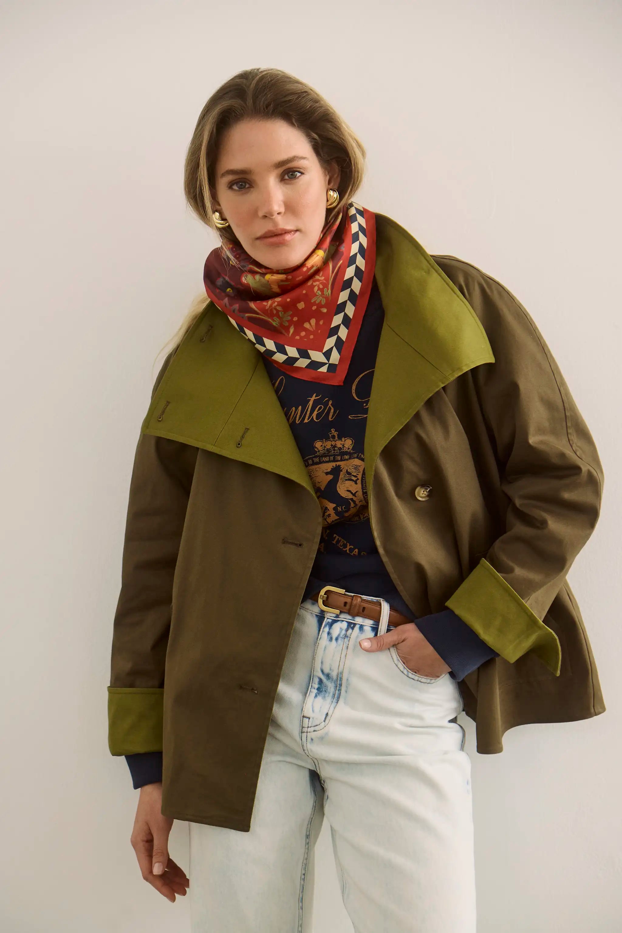 The Howell Cropped Trench paired with the Heritage Sweatshirt and Wray Pant in Washed Blue Denim.