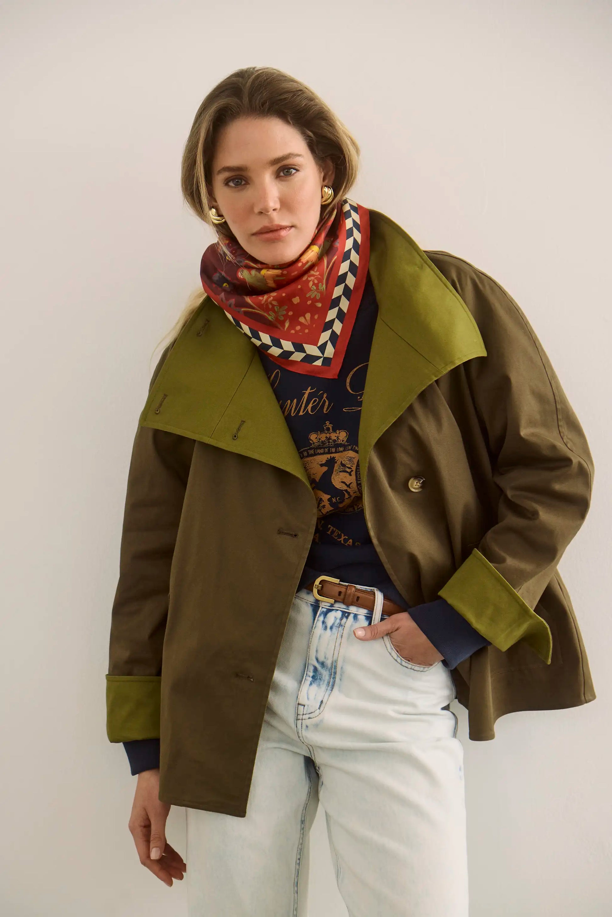 The Howell Cropped Trench paired with the Heritage Sweatshirt and Wray Pant in Washed Blue Denim.