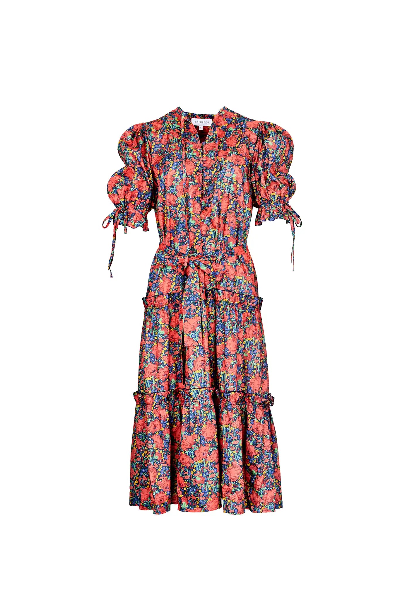 The Holloway Dress has v-neck, elbow-length puff sleeves, tiered ruffled seams and an optional sash.