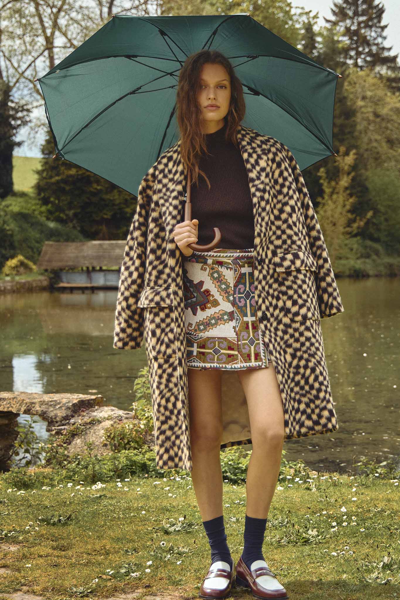 The Powell tapestry mini skirt has A banded waist and elegant wrap silhouette.