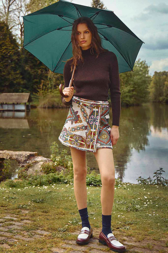 The Powell tapestry mini skirt has A banded waist and elegant wrap silhouette.