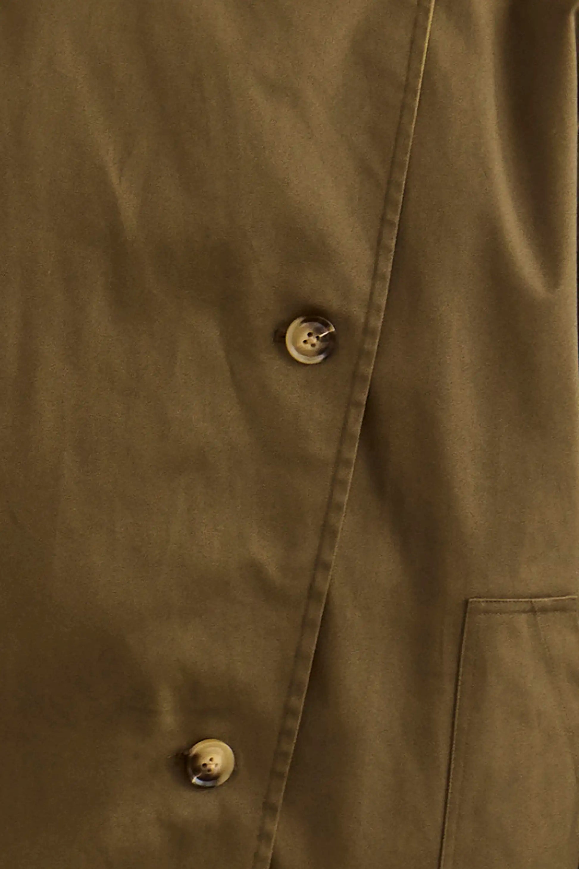 Close up of the Howell Cropped Trench in Khaki Brown. 