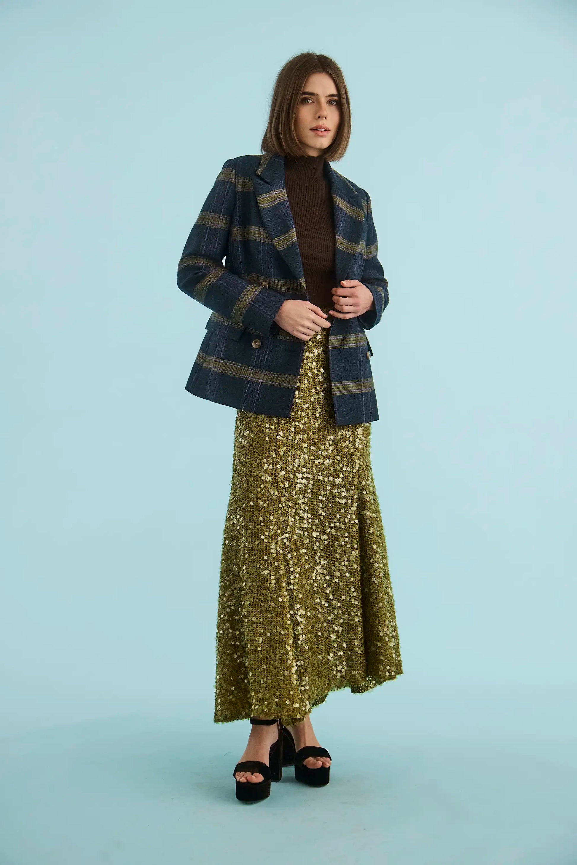 The Huntley Blazer in Stirling Plaid paired with the Lindsey Skirt in Moss Sequin. 