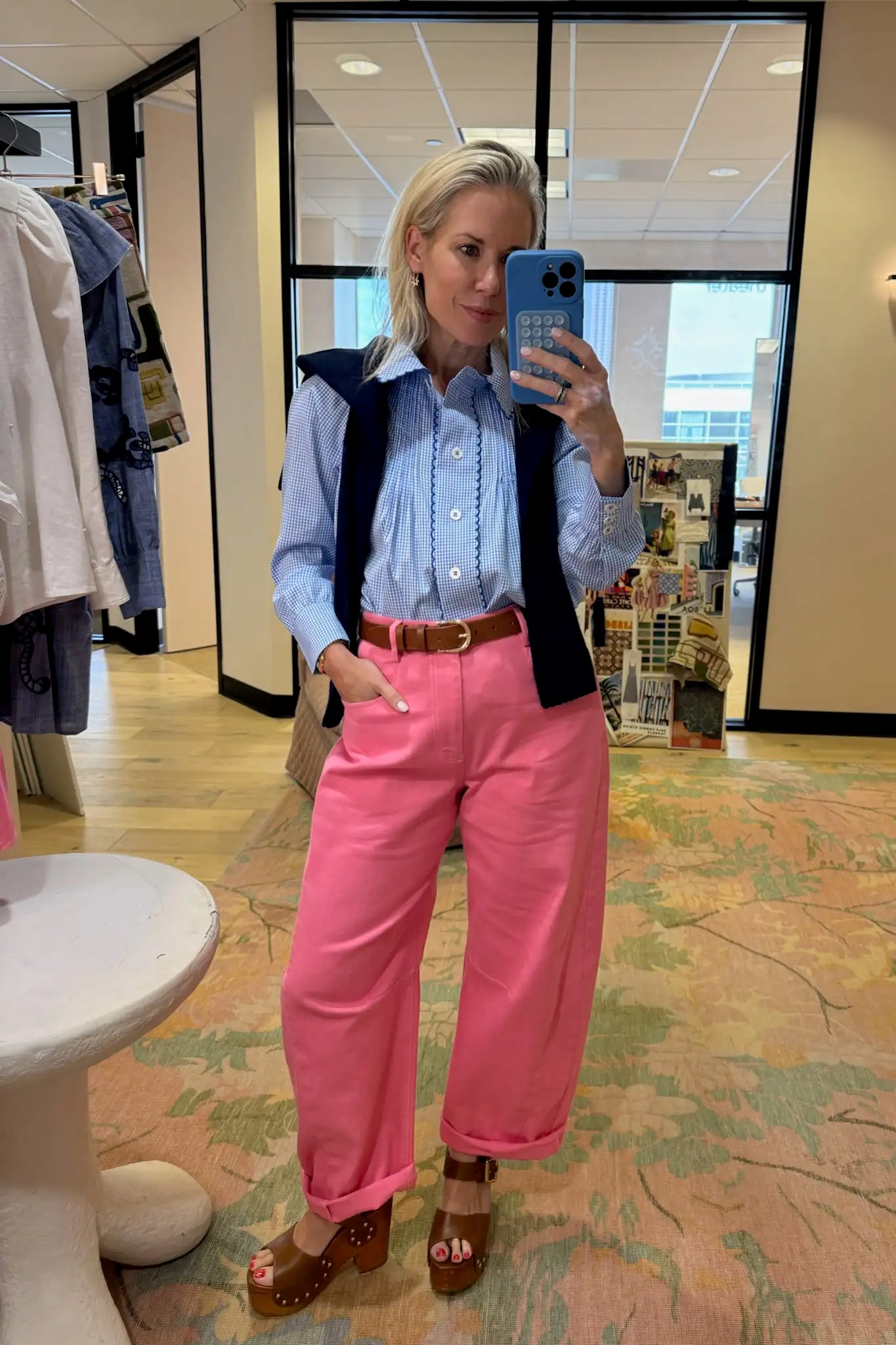 Blue and white gingham button down with a button front placket, shoulder puffing, and pintuck detail