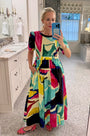 Midi dress in colorful print including pink, green, pink and black with side bodice cut-outs.
