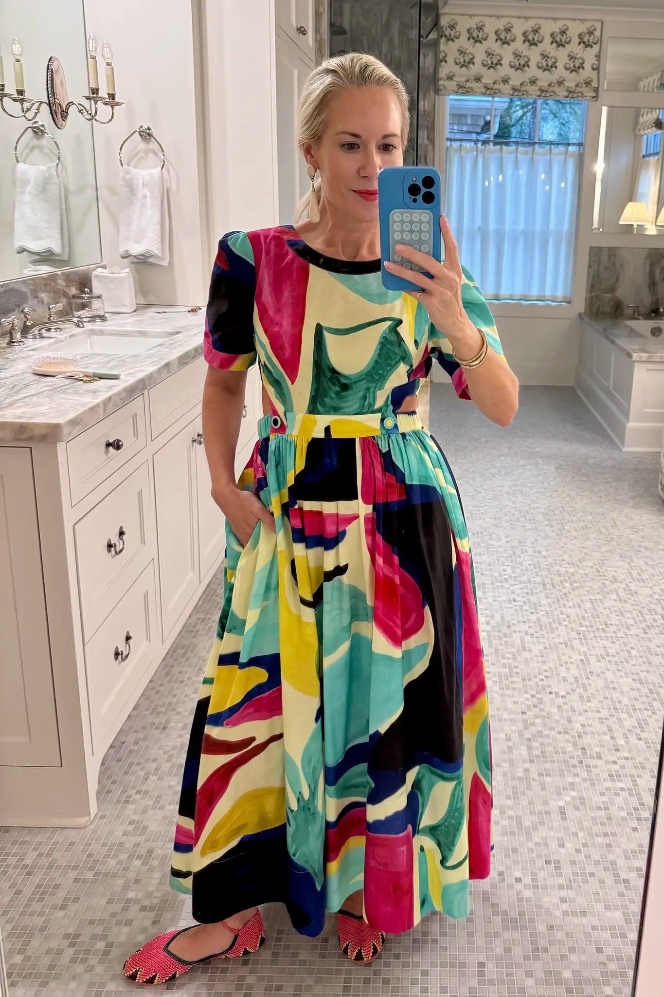 Midi dress in colorful print including pink, green, pink and black with side bodice cut-outs.