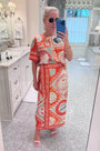 Hunter wearing the Maeve Top and Paloma Wrap Skirt.
