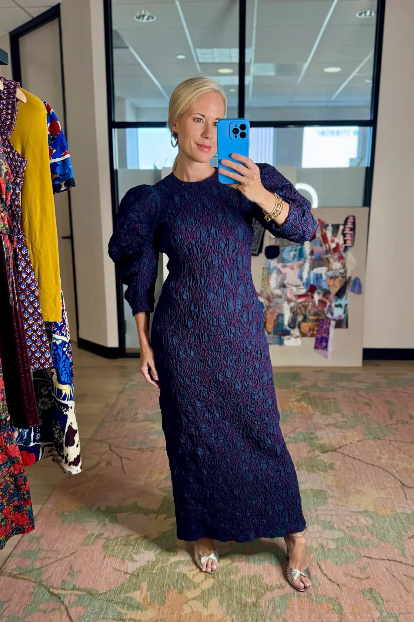 The Blythe Dress is midi body con dress with a crew neckline and oversized ruched long sleeves.