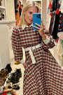 The Randolph Dress has a circle skirt, full length sleeves with button cuffs and optional belt.