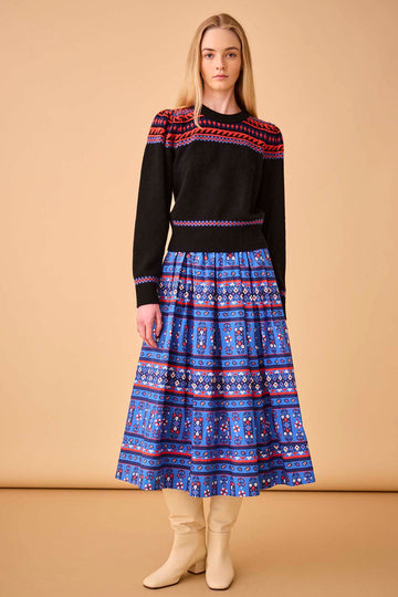 The Tatum block print midi skirt has a covered elastic waistband, a relaxed fit.